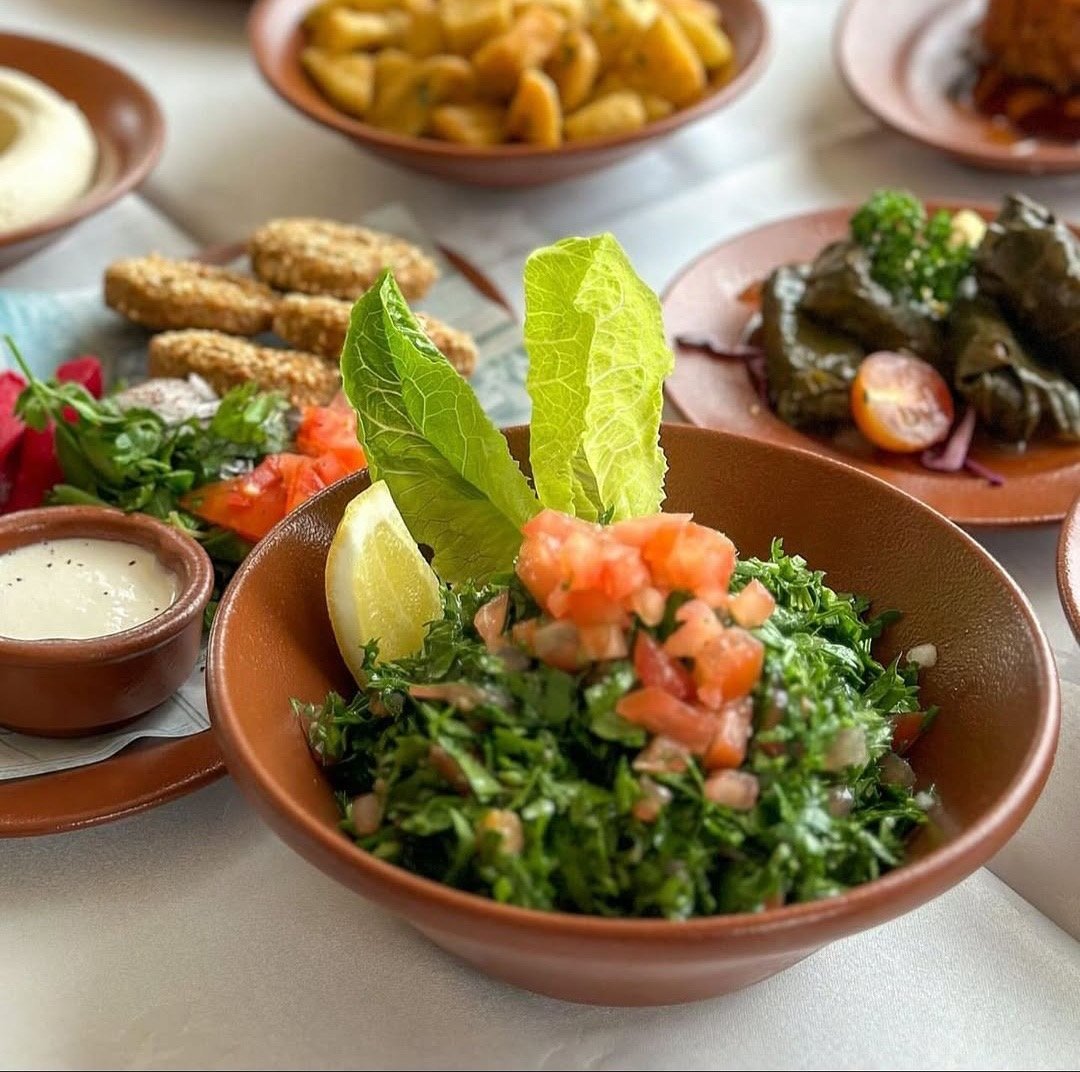 Lebanese mezze spread with tabbouleh, hummus, kibbeh and stuffed grape leaves